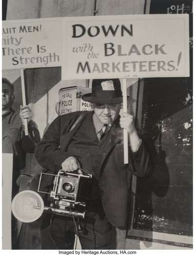 Weegee (American, 1899-1968) Self-Portrait Holdi