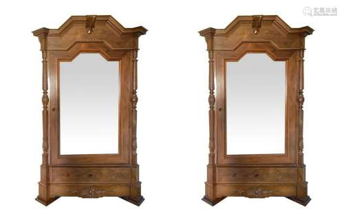 Pair of cabinets with mirror to one door.