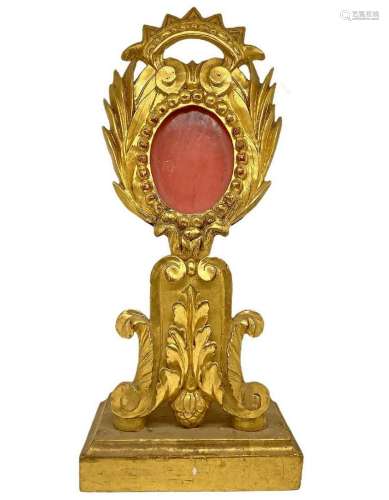 Reliquary in golden leaf wood.