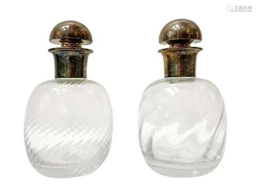 Pair of cordoned glass bottles with silver metal cap,