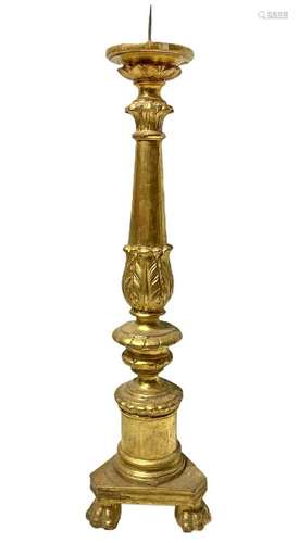 Golden wood candlestick.