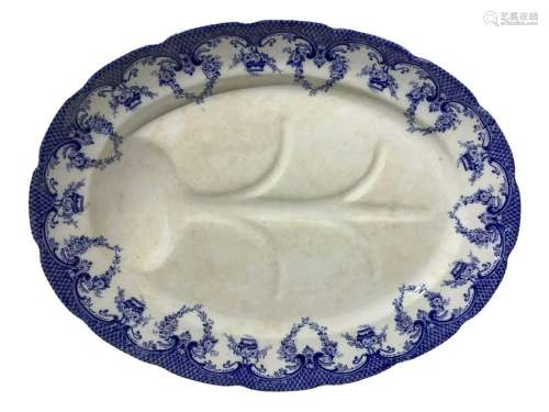 Oval porcelain plate with blue decorations at the edges