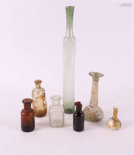 A lot of various glass flasks and bottles with iridescence, ...