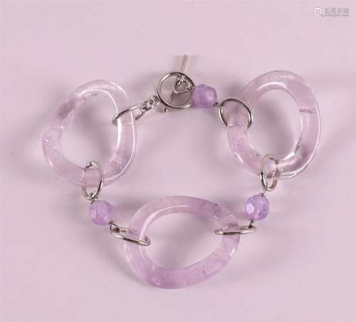 A first grade silver bracelet with oval links and amethyst b...
