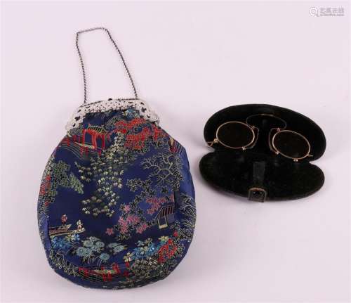 A silver purse bracket on a non-original cloth bag, 19th cen...