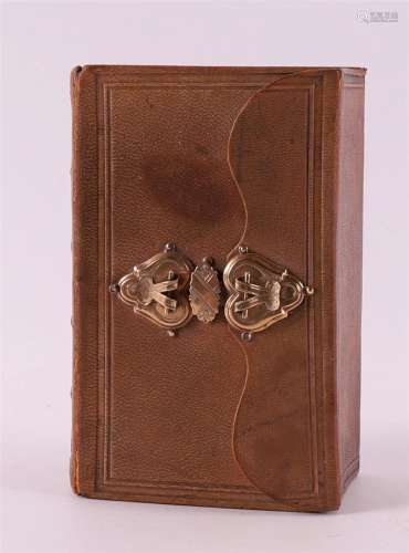 A bible/psalm booklet in brown leather binding with gold cla...