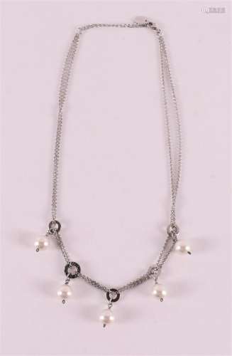 A first grade silver design necklace with pearl and black st...