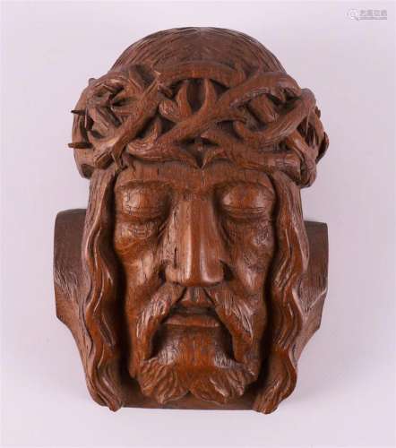 A carved oak face of Jesus Christ with a crown of thorns, ci...