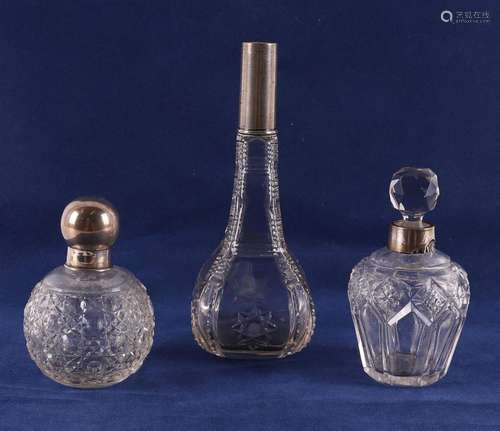 Two assorted clear crystal flasks with silver mounts, early ...