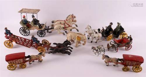 A lot of various cast iron toys, including a carriage and fi...