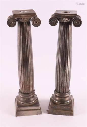 A pair of silver-plated bronze single-light candlesticks, 20...