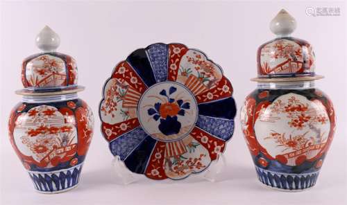 A pair of porcelain Imari vases with lids, Japan, Meiji, aro...