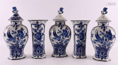 A five piece Delft earthenware garniture, Porceleyne bottle,...