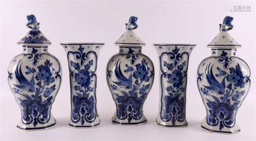 A five piece Delft earthenware garniture, Porceleyne bottle,...