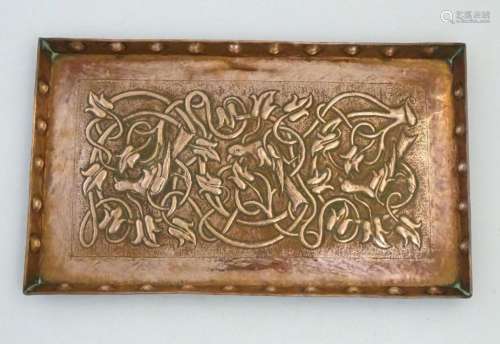 An Arts and Crafts hammered copper tray of rectangular form ...