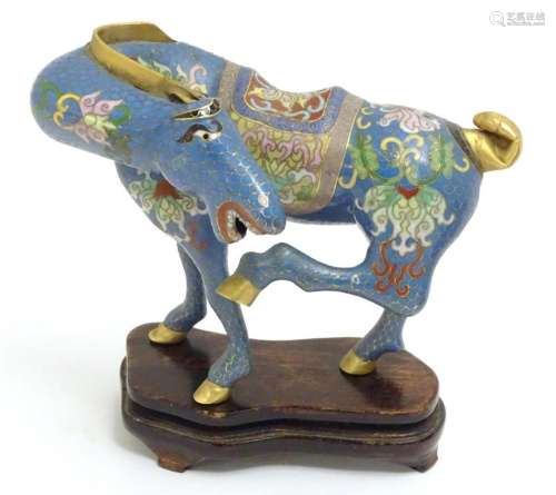 A Chinese cloisonne horse with raised back leg and turned he...
