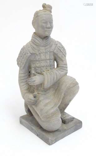 A 20thC model of a Chinese terracotta warrior depicting a kn...