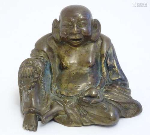 A Chinese cast model of Budai - The Laughing Buddha. Approx....