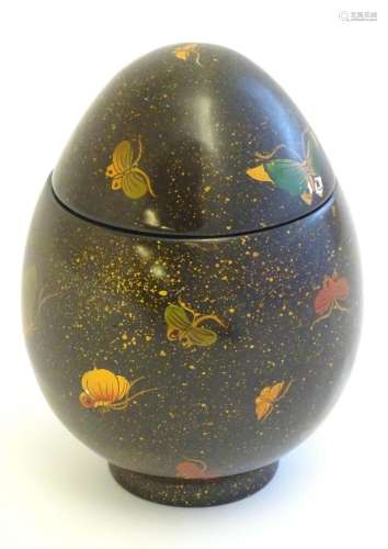 A Japanese lacquered pot and cover of egg form, decorated wi...