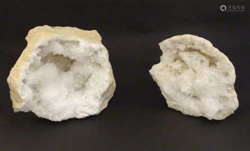 A large split quartz crystal geode in two sections. Largest ...