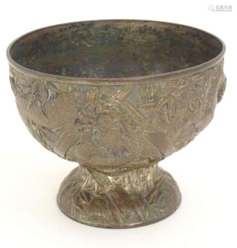 An Oriental cast pedestal bowl with relief decoration depict...