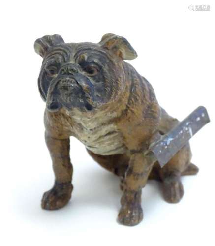 A 20thC cold painted cast model of a seated bulldog. Approx....