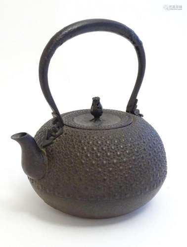 An Oriental cast tetsubin style teapot / kettle with relief ...