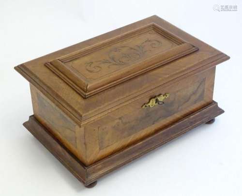 A 20thC Continental jewellery box of casket form with scroll...