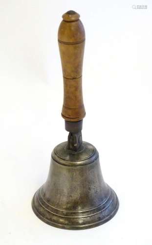 A 20thC hand bell with turned fruitwood handle with banded d...