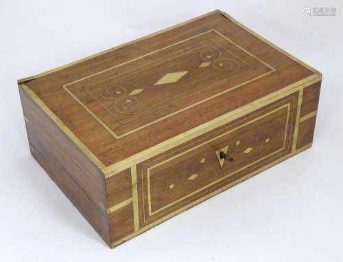 A Victorian mahogany box with brass banding and scrolling br...