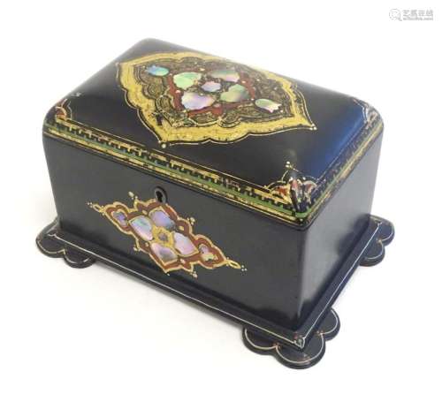 A Victorian lacquered papier mache two sectional tea caddy w...