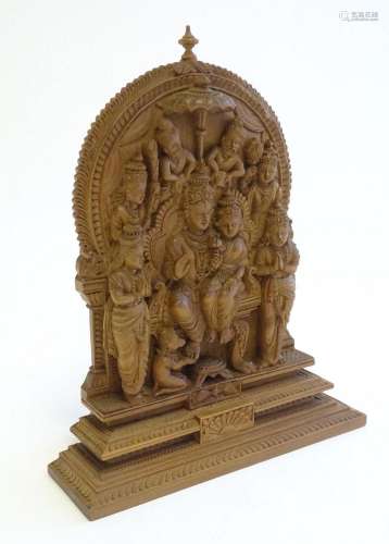 A 20thC Indian deity carving depicting two enthroned figures...