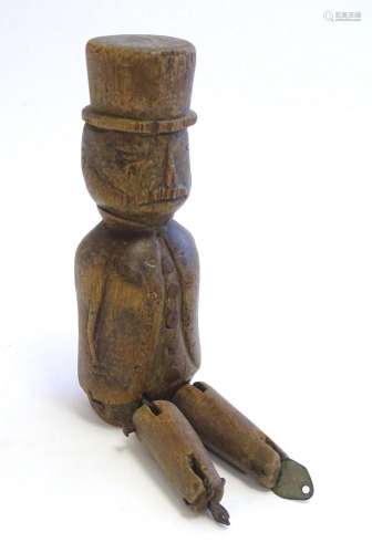 A 19thC folk art carved wooden naive model of a gentleman we...