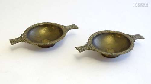 A pair of Scottish brass quaich with Celtic decoration and i...