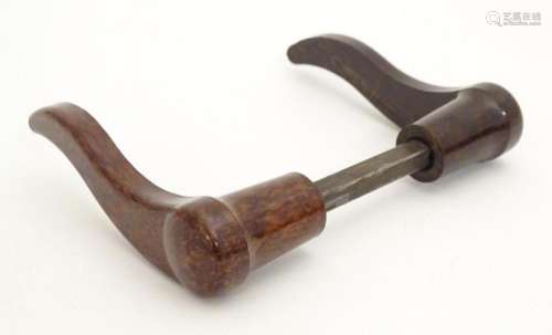 A pair of 20thC Bakelite lever door handles in mottled brown...