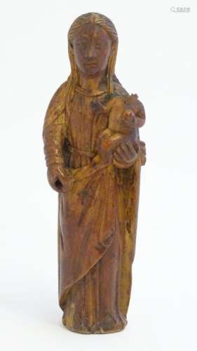 A 19thC Continental carved wooden model of mother and child,...