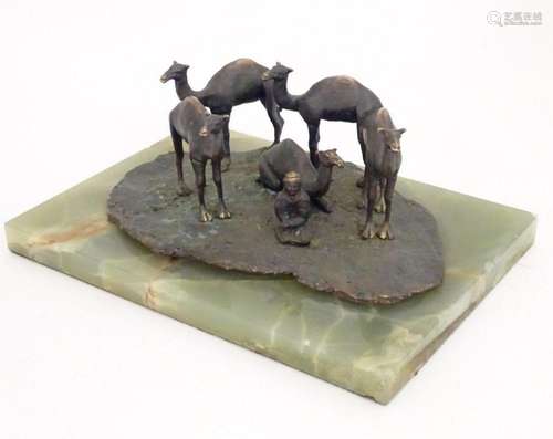 A late 19th / early 20thC bronze sculpture depicting camels ...