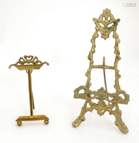 Two 19thC cast brass table top easels, one with floral and f...