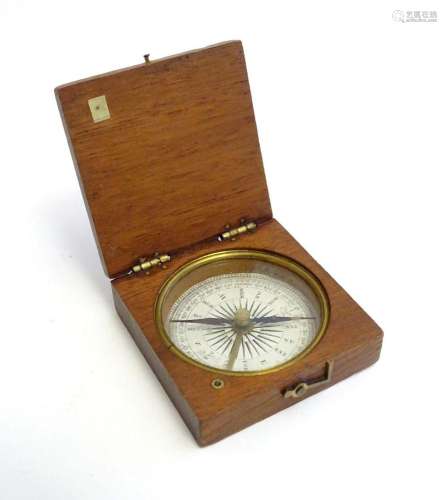 An early 20thC cased travel / pocket compass with a printed ...