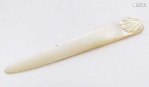 An early 20thC mother of pearl letter opener with shell deta...