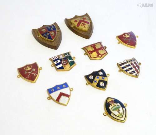 A collection of gilt metal enamelled collegiate insignia / b...
