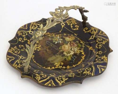 A Victorian papier mache dish with swing handle with lacquer...