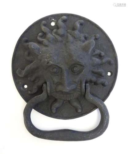A 20thC cast door knocker with mask detail. Approx. 8 1/4&qu...
