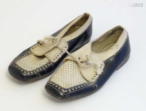 A pair of Continental black and white leather children'...