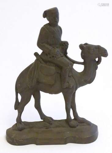 A 20thC cast door stop / door porter modelled as a man ridin...