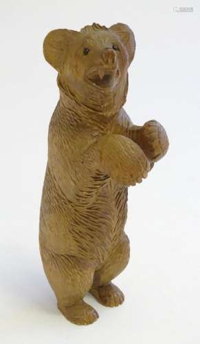 A Victorian black forest style carved wooden model of a bear...