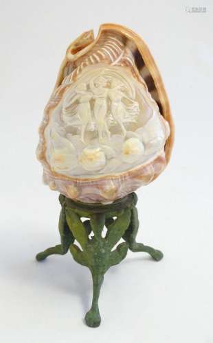 A 20thC table lamp shade and base formed from a conch shell ...