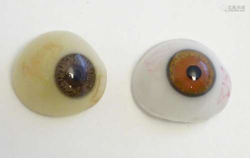 Two 19thC prosthetic glass human eyes with brown irises. Lar...