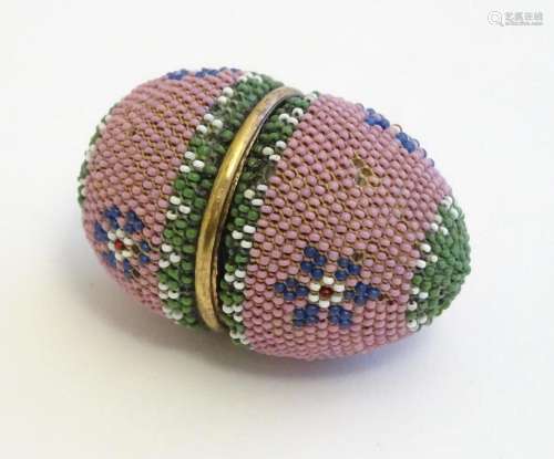 A Victorian etui / necessaire case of egg form with beadwork...