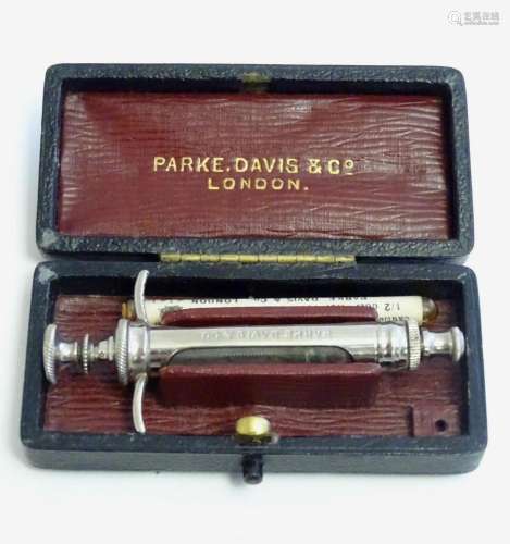 An early 20thC cased syringe and needles by Parke, Davis &am...